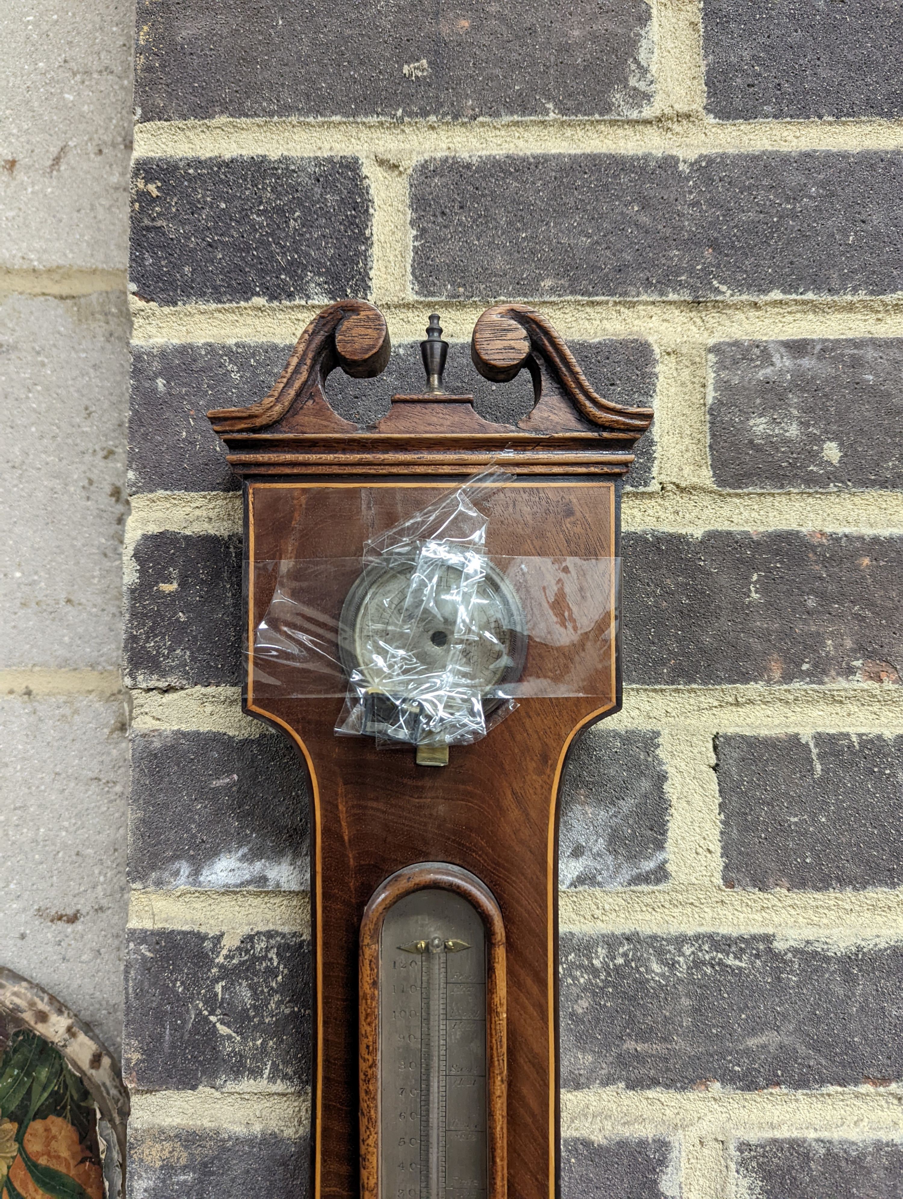 A Regency strung mahogany wheel barometer by J. Spelzini, Holborn, height 109cm